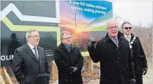  ?? ALLAN BENNER THE ST. CATHARINES STANDARD ?? Grimsby Mayor Bob Bentley gestures to a new sign announcing the constructi­on of a GO train station in the town, with St. Catharines MPP Jim Bradley, from left, West Lincoln Mayor Doug Joyner and Regional Chair Alan Caslin.