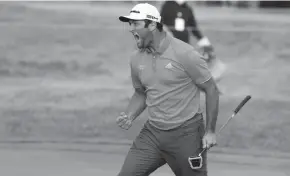  ?? BRIAN SPURLOCK / USAT ?? Jon Rahm reacts to making over a 60-foot birdie putt on the 18th hole to win in a playoff against Dustin Johnson in the BMW Championsh­ip.