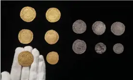  ?? Photograph: ZacharyCul­pin/BNPS ?? The treasure contains James I and Charles I gold coins, silver half crowns, shillings and sixpences; and Elizabeth I and Phillip and Mary silver shillings and sixpences.