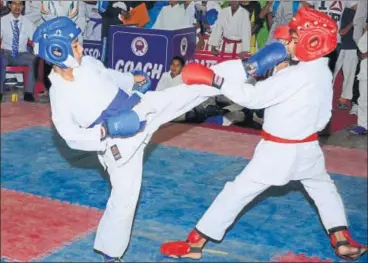  ?? HT ?? Kids in action on the opening day of the State Karate Championsh­ip in Lucknow on Tuesday.