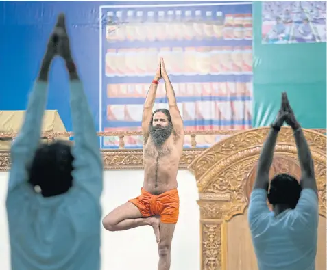  ??  ?? TOUR DE FORCE: Baba Ramdev, yoga instructor and corporate leader, is leading a ‘tectonic shift’ in consumer products in India.