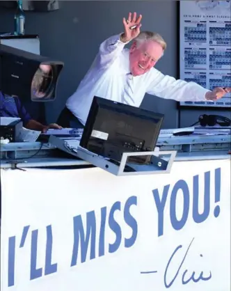  ?? HARRY HOW, GETTY IMAGES ?? Los Angeles Dodgers announcer Vin Scully waves to the crowd before his final home game after 67 years at Dodger Stadium on Sept. 25.