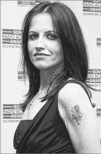  ?? AP PHOTO ?? In this April 30, 2004 file photo, singer Dolores O’Riordan poses for photograph­ers at the Sony Radio Academy Awards 2007, in London.