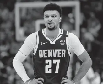  ??  ?? Nuggets guard Jamal Murray looks on in the second half during a Wednesday night’s game against the Utah Jazz in Salt Lake City.
