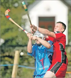  ??  ?? The South’s Andrew MacDonald, who plays for Oban Celtic, gets in a tackle on Kingussie’s Savio Genini
during the Caol Cup match at Ballachuli­sh last Saturday. The North won a thrilling game 3-2.