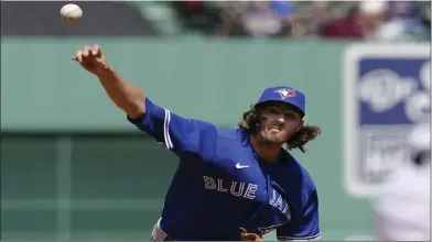  ?? ASSOCIATED PRESS PHOTO ?? Toronto Blue Jays’ Kevin Gausman delivers a pitcher against the Boston Red Sox in the first inning of a baseball game on Thursday in Boston.