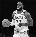  ?? MARCIO JOSE SANCHEZ/AP ?? LeBron James hit the go-ahead jumper in the Lakers’ 114-112 victory Sunday.