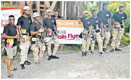  ??  ?? Zipline guides pose for Hospitalit­y Jamaica’s camera.