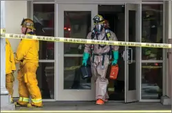  ?? Austin Dave/The Signal ?? An official with the hazmat unit exits Stevenson Ranch Library after a white powder, which caused an evacuation, was found to be a cleaning product on Thursday.