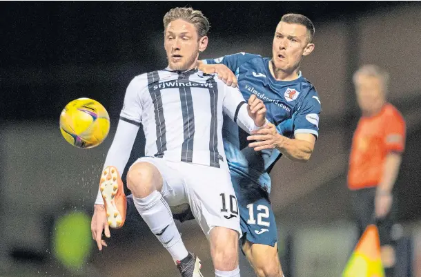  ?? ?? UP FOR THE BATTLE: Raith’s Ross Matthews challenges Declan McManus of Dunfermlin­e during a derby clash at Stark’s Park last season.