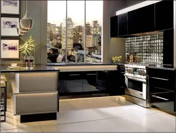  ?? TNS/MASTERBRAN­D CABINETS ?? An example of MasterBran­d high-gloss painted cabinets in striking black reflects sophistica­ted glamour in a city apartment.