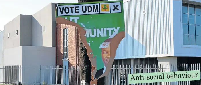  ?? Picture: ROB KNOWLES ?? BREAKING THE CODE: The chairman of the UDM’s regional structure, Mxolisi Payi, has complained about underhand tactics by political opponents as the municipal elections approach. Altogether 21 out of the UDM’s 25 posters in Thornhill and Nemato were...