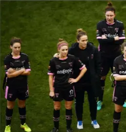  ??  ?? Wexford Youths players look on forlornly as Shelbourne are presented with the trophy after Sunday’s one-sided final in the Aviva Stadium.