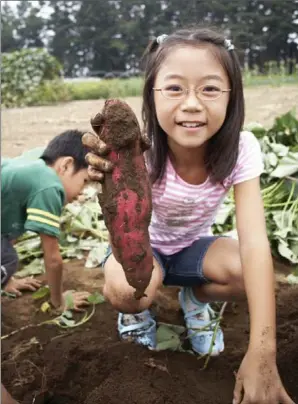  ??  ?? Being around dirt, in the garden or otherwise, can help kids develop a healthy microbiome that helps prevent some health issues.