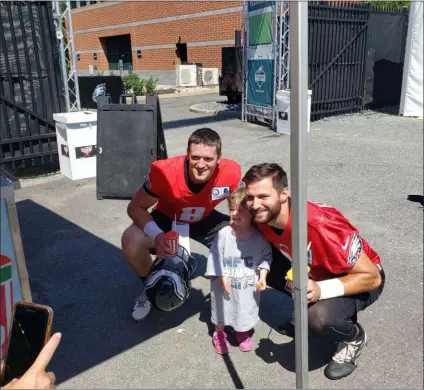  ?? MEDIANEWS GROUP ?? Clayton Thorson and Cody Kessler pose with an Eagles’ fan at the Rita’s Water Ice tent after the Monday morning practice at the NovaCare Complex.