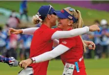  ?? AP PHOTO/MATT YORK ?? U.S. golfer Nelly Korda, left, celebrates with her older sister Jessica Korda after winning the gold medal on the 18th hole during the final round of the Tokyo Olympics’ women’s golf tournament Saturday in Kawagoe, Japan. She closed with a 69 for a one-shot victory and her first medal.