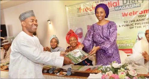  ??  ?? Publisher Presidenti­al Diary Magazine, Dr. Abubakar Jimoh, presents a copy of the magazine to the Wife of the president’s representa­tive, Mrs. Dolapo Osinbajo, wife of the vice president, during the formal launch of the magazine in Abuja on Tuesday