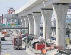  ?? VARUTH HIRUNYATHE­B ?? Constructi­on work proceeds on the MRT Orange Line. The fiscal 2021 investment budget is projected at B693bn, or 21% of the total.