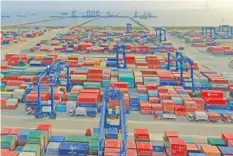  ?? CHINATOPIX VIA AP, FILE ?? A container port on the Yangtze River is seen in an aerial view in Nantong in eastern China’s Jiangsu province. China reported its April imports and exports surged over the same month in 2020 as global demand strengthen­s.