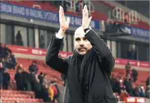  ?? PAUL ELLIS/AFP ?? Manchester City manager Pep Guardiola applauds the fans after beating Stoke 2-0 in their English Premier League match on Monday night.