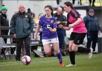  ??  ?? Jasmine Martin moving down the wing for Wexford under the watchful eye on manager Michael Bennett.