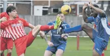  ??  ?? Ryhope CW (red and white) battle Harrogate RA in the FA Vase.