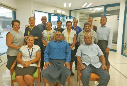  ??  ?? Tower Insurance staff with country manager for Fiji, Joseph Magnus (sitting middle).