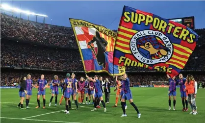  ?? ?? Barcelona’s players wave flags as they celebrate in front of over 90,000 fans at Camp Nou. Photograph: David Ramos/Getty Images