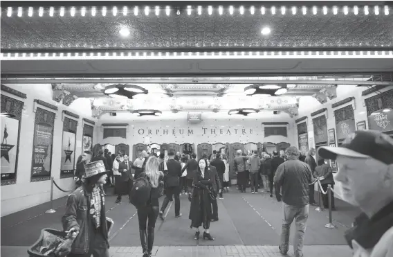  ?? Michael Short / Special to The Chronicle ?? Audience members mingle at the Orpheum Theatre before the first San Francisco performanc­e of the hugely popular Broadway musical “Hamilton.”
“Hamilton”: Scheduled SHN run through Aug. 5. Ticket informatio­n and more: www. hamilton.shnsf.com