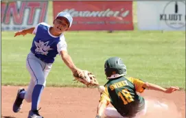  ?? MIKE BUSH/NEWS-SENTINEL ?? Above: Lodi 11s shortstop Rylan Takahashi reaches for the ball while trying to tag out Kingsburg baserunner Peyton Swiney in Wednesday's Central California Cal Ripken State Tournament game at Salas Park. Below: Lodi 11s batter Johnathan Trillas makes contact.