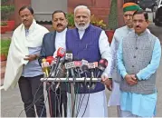  ?? (AFP) ?? Indian Prime Minister Narendra Modi (centre) addresses media after arriving for the winter session of parliament in New Delhi on Monday