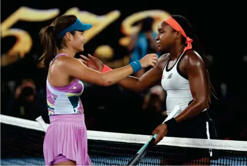  ?? (Reuters) ?? Emma Raducanu and Coco Gauff embrace at the net after the match