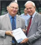  ??  ?? Canterbury’s John Halliday receives his cricket lifetime achievemen­t award from Derek Underwood