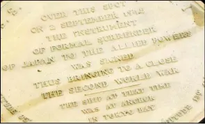  ?? ASSOCIATED PRESS ?? In this Aug. 11 file photo, a plaque marks the spot where World War II surrender documents were signed on the USS Missouri Memorial in Pearl Harbor, Hawaii.