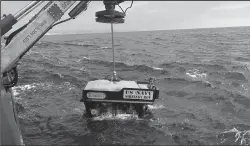  ?? LT. CURTIS KHOL/U.S. NAVY/TNS ?? Undersea Rescue Command deploys the Sibitzky Remotely Operated Vehicle in the Pacific Ocean on Monday from the deck of the Military Sealift Command-chartered merchant vessel HOS Dominator. Undersea Rescue Command is aiding in recovery of the missing seven Marines and one Sailor from the 15th Marine Expedition­ary Unit.