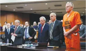  ?? TRACY GLANTZ/THE STATE VIA AP, POOL ?? Alex Murdaugh, convicted of killing his wife, Maggie, and younger son, Paul, in 2021, stands with his defense team Jan. 16 during a hearing on a motion for a retrial at the Richland County Judicial Center in Columbia, S.C.