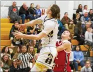  ?? BARRY BOOHER — THE NEWS-HERALD ?? Riverside’s Jameson Campbell blocks a layup attempt by Perry’s Drew Schiano on Jan. 13.