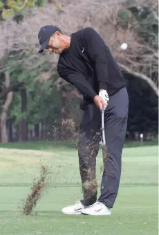  ?? — AFP ?? Tiger Woods of the US hits a second shot at the second hole during the first round of the Zozo Championsh­ip at the Narashino Country Club in Inzai, Chiba prefecture, Japan.