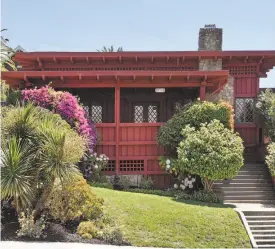  ??  ?? Above: The formal dining room at 990 Vermont St. in Oakland features inlaid hardwood flooring, lattice windows and tall wainscotin­g. Below: Oakland architect Leo L. Nichols designed the three-bedroom Craftsman home.