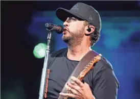  ?? EBONY COX / MILWAUKEE JOURNAL SENTINEL ?? Luke Bryan headlines the American Family Insurance Amphitheat­er during Summerfest on Sept. 2.