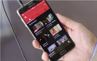  ??  ?? LOS ANGELES: This Friday, Nov. 13, 2015, file photo shows the YouTube music app on a mobile phone. —AP