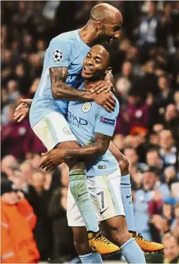  ??  ?? He ain’t heavy: Raheem Sterling (right) celebratin­g with a teammate after scoring the second goal for Manchester City against Shakhtar Donetsk on Tuesday. — AP