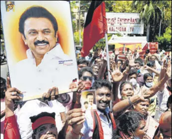  ?? AFP ?? DMK members celebrate the party’s win in the state elections, in Chennai on Sunday.