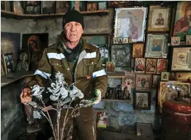  ?? Photo: 2News ?? Viktor Mikhalev shows roses transforme­d from weapons and ammunition into flowers of war in his workshop in Donetsk, Russia.