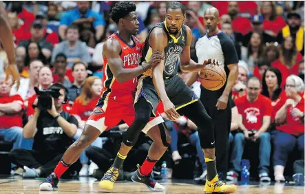  ?? SEAN GARDNER/GETTY IMAGES ?? Jrue Holiday and the New Orleans Pelicans had no answer for Golden State Warriors forward Kevin Durant Sunday in Game 4 of their Western Conference semifinal as Durant piled up 38 points in a 118-92 victory at New Orleans’ Smoothie King Center.