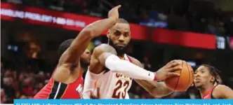  ??  ?? CLEVELAND: LeBron James #23 of the Cleveland Cavaliers drives between Dion Waiters #11 and Josh Richardson #0 of the Miami Heat during the second half at Quicken Loans Arena in Cleveland. — AFP