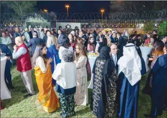  ?? ?? Ambassador’s wife interactin­g with some of the female guests.