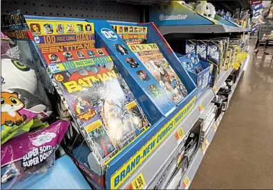  ?? NWA Democrat-Gazette/BEN GOFF ?? A series of 100-page anthology comic books featuring popular DC Comics superheroe­s is displayed at the Walmart Supercente­r on Pleasant Crossing Boulevard in Rogers.