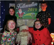  ??  ?? Eoghan, Katie, Grace and Lucy Forde with Santa Claus at the Killavulle­n Christmas extravagan­za.