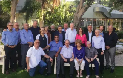  ?? (Courtesy Peretz campaign) ?? ZIONIST UNION MK Amir Peretz, running for leadership of the Labor Party (standing center, in dark jacket), poses with supporters yesterday outside the Kfar Hamaccabia­h Hotel in Ramat Gan.